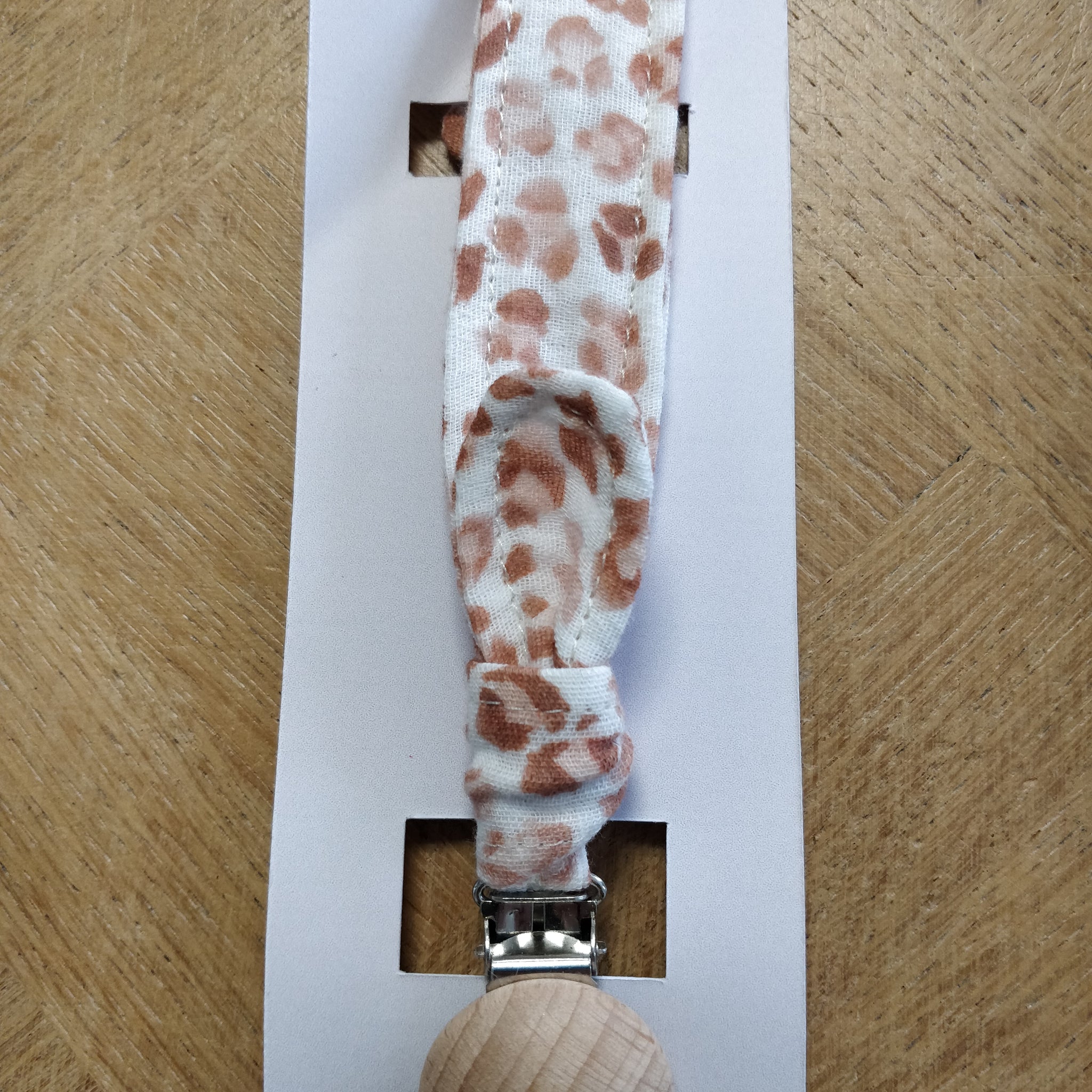 Attache tétine double gaze